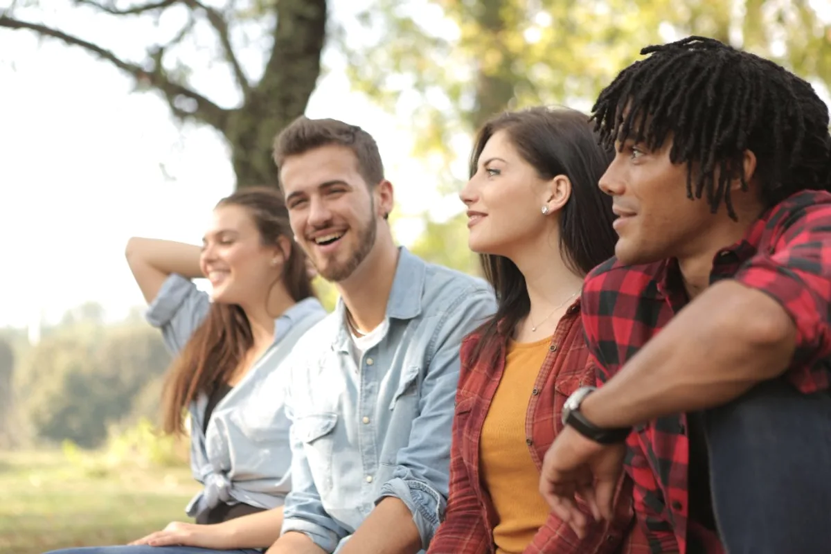 Group of friends laughing together outdoors